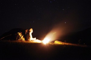 A night shot of the tent with a little campfire burning on the shoreline of Loch Etive