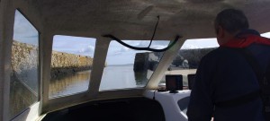 View of St Andrews ancient stone built harbour wall from Ian's Raider 18