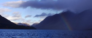 A rainbow shines through the clouds on a very mixed day on Loch Etive