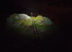 Keeping an eye on the rod tips whilst night fishing from the top of Red Rock, around 60 feet above sea level.