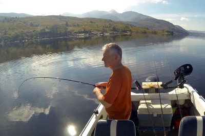 Playing a small Etive codling caught on light spinning rod