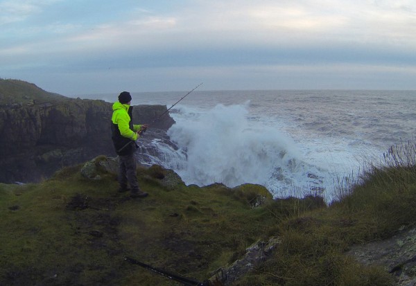 Fishing off the cliffs in rough seas