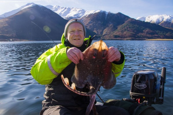 Me. with the first thornback of the day and a lot of snowy mountain tops for background