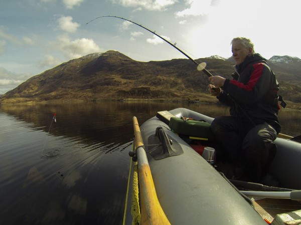 Bringing a thornback alongside the SIB, Loch Leven