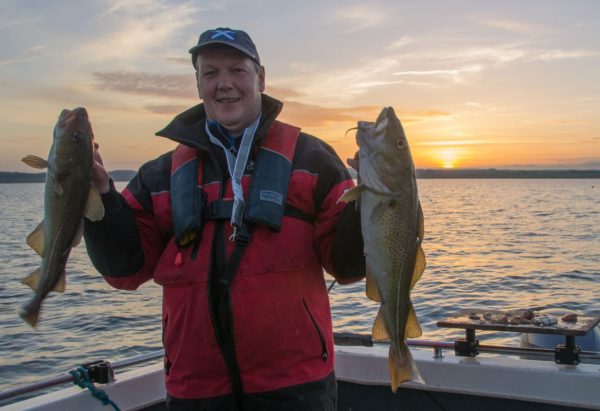 Ian with a nice brace of autumn codling caught from St Andrews