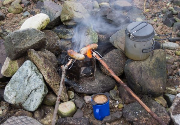 A late winter BBQ on Etive - coffee and sausages cooked over a charcoal brazier ward off the cold on a chilly day.