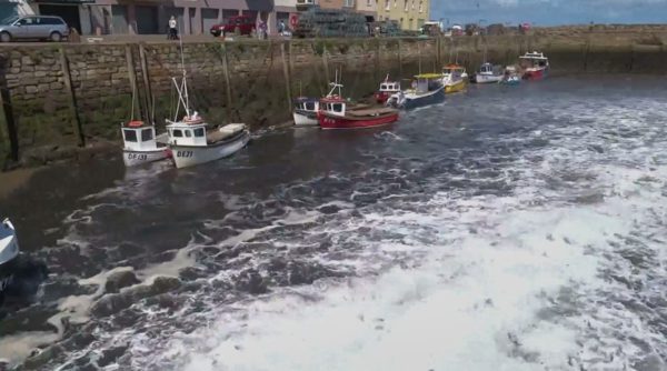 Sluice gates in the harbour are opened