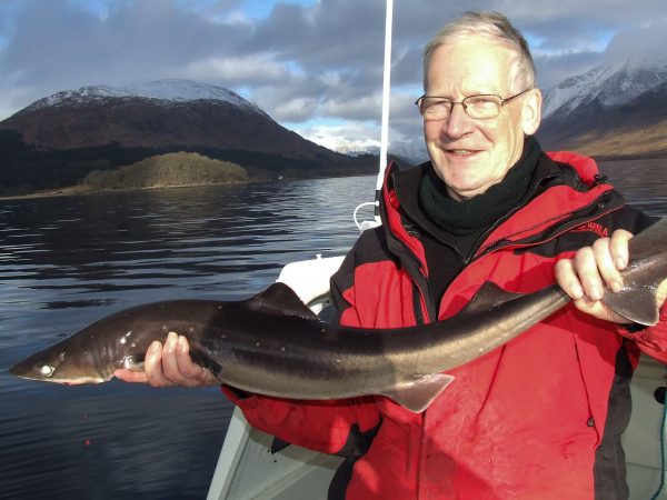 Me holding a nice spurdog with Glen Etive in the background