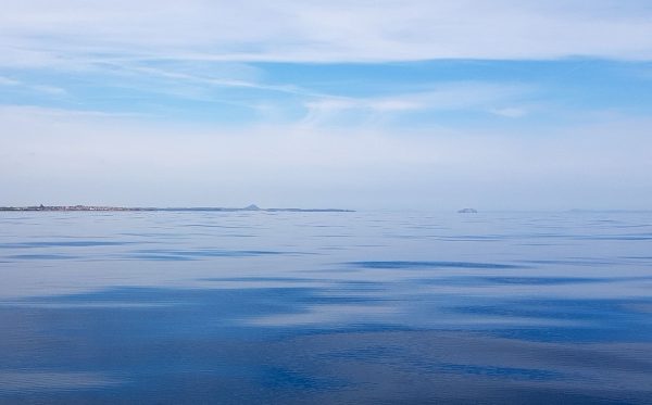 Beautiful calm sea and looking towards the Bass Rock from a spot a few miles east of Dunbar