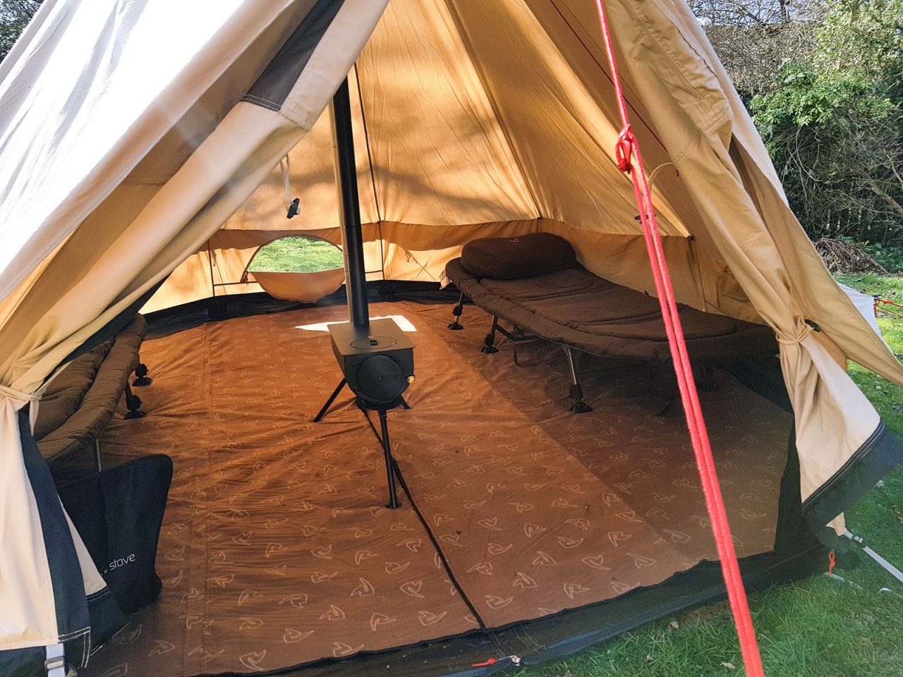 Glamping here we come - standing headroom, woodburner, carpet and beds.