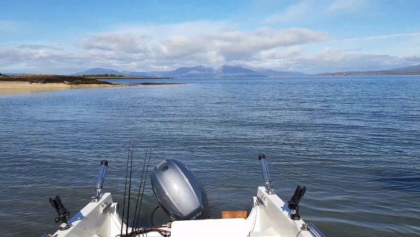 Launching into a calm sea at Gallanach, with Mull in the background