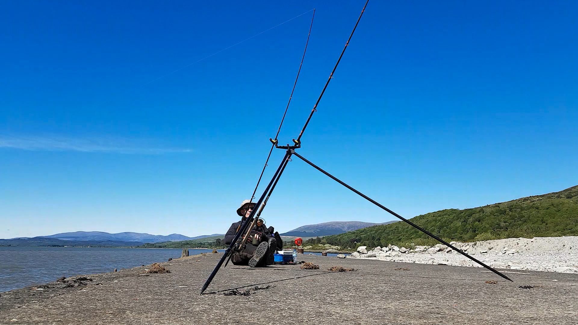 A lazy sunny afternoon fishing from an old pier on the Cree estuary, Galloway