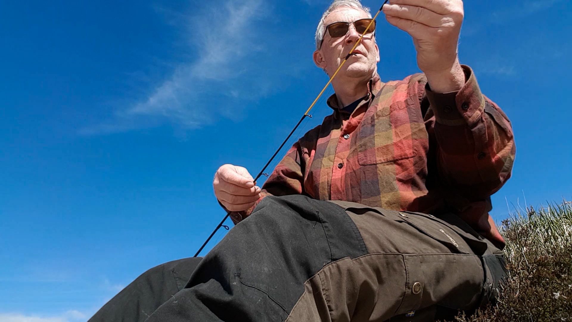 Setting up my spinning rod for a little session on a hill loch in Galloway