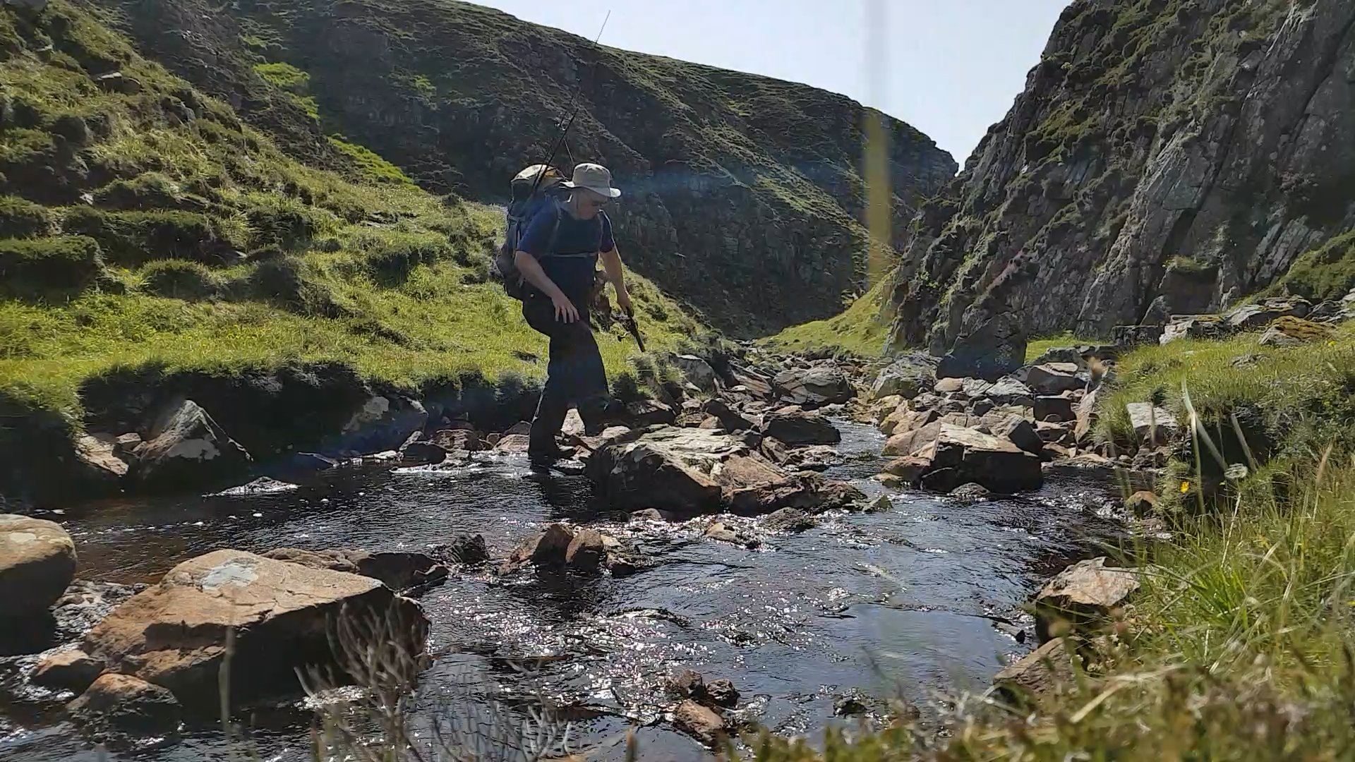 Crossing the small. steep gorge that forms the last obstacle to reaching my campsite for the night. Near Cape Wrath, NW Scotland