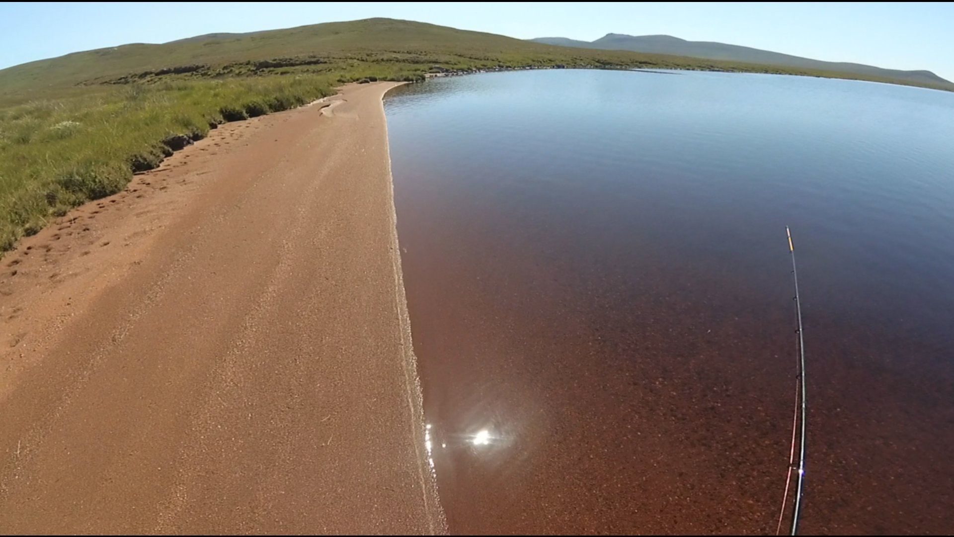 A pretty unproductive session on a shallow little loch in hot, sunny and flat calm weather.