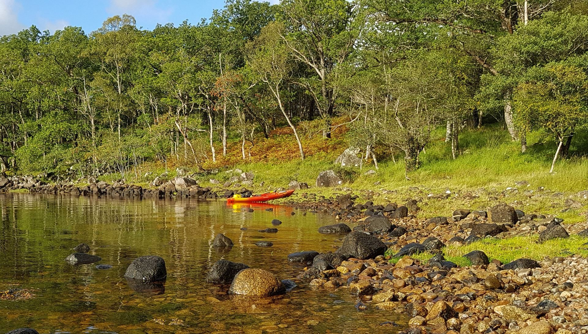 Late summer, or early autumn? Either way, my bright orange and yellow kayak adds additional colour to the scene